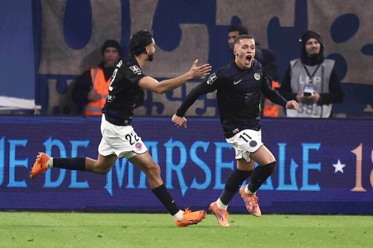 Santiago Hidalgo (R) celebrates after scoring a late equaliser for Toulouse against Marseille