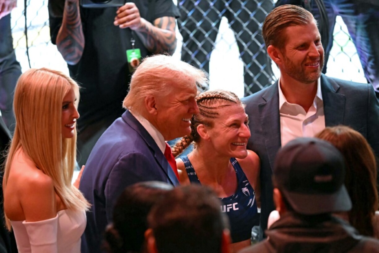 US President Donald Trump (C) is a regular fixture at some of UFC's most high-profile events