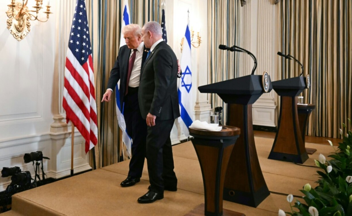 US President Donald Trump and Israeli Prime Minister Benjamin Netanyahu depart at the conclusion of a joint press conference at the White House