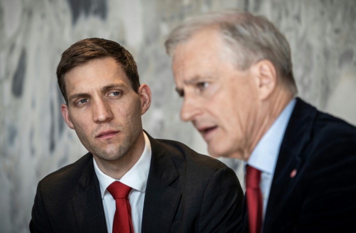 Andreas Bjelland Eriksen, pictured left with Norway's Prime Minister Jonas Gahr Store, says he and his cousin Berg disagree on how to reduce fossil fuel emissions