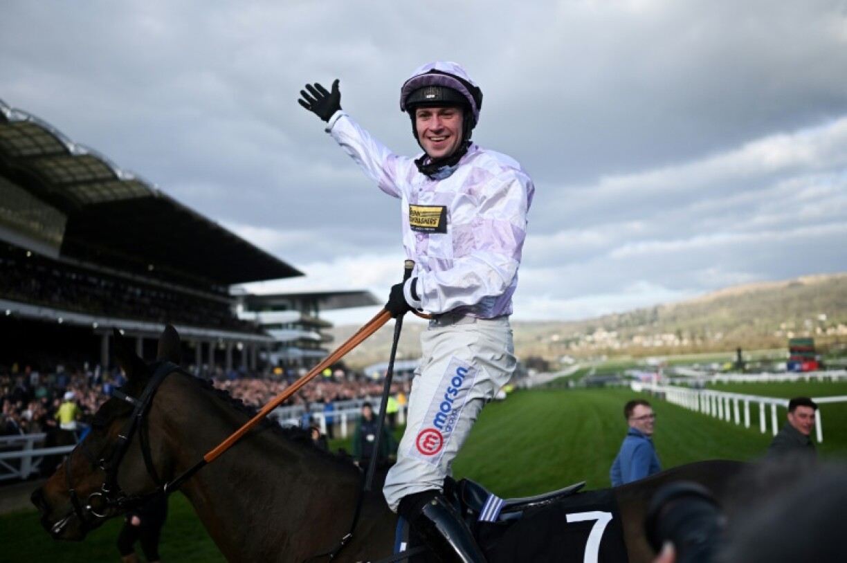 Lorcan Williams celebrates as he and Golden Ace landed a shock win in the Champion Hurdle which saw the two highly-fancied previous winners fall