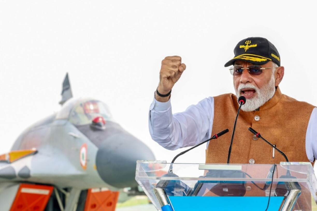 A handout photograph by the Indian Press Information Bureau shows Indian Prime Minister Narendra Modi addressing troops in a Kashmir air base