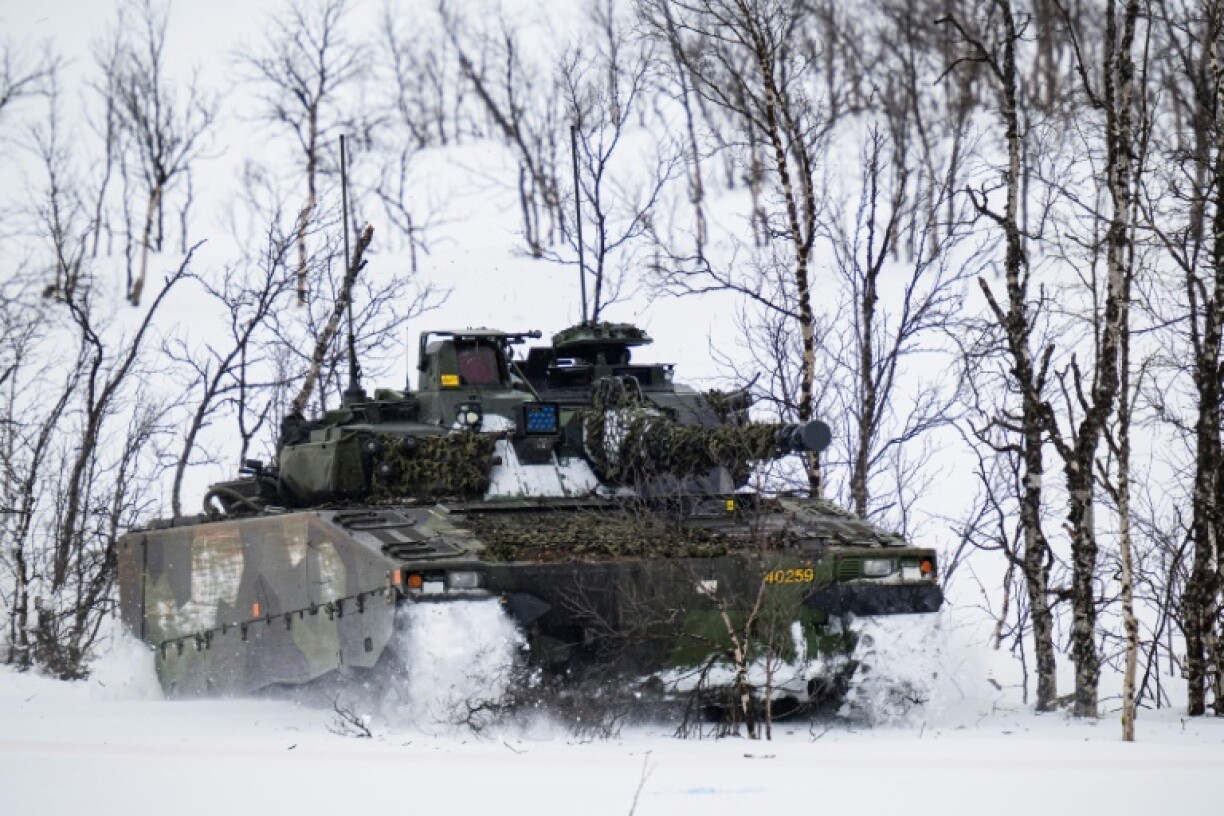 A Swedish CV90 trains in northern Norway during a NATO exercise in March 2024