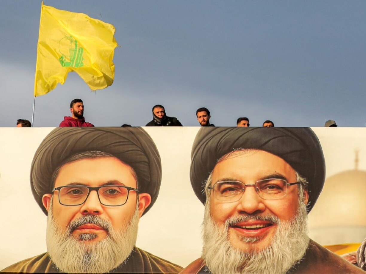 A giant portait of slain Hezbollah leader Hassan Nasrallah (R) and his heir apparent Hashem Safieddine watches over Beirut's airport highway ahead of their funeral on Sunday.
