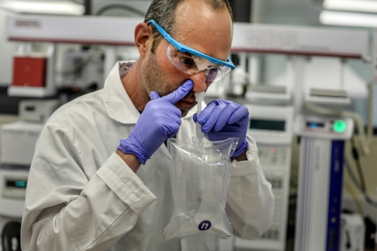 A researcher demonstrates a coronavirus breathalyser test at a NanoScent lab in Israel.