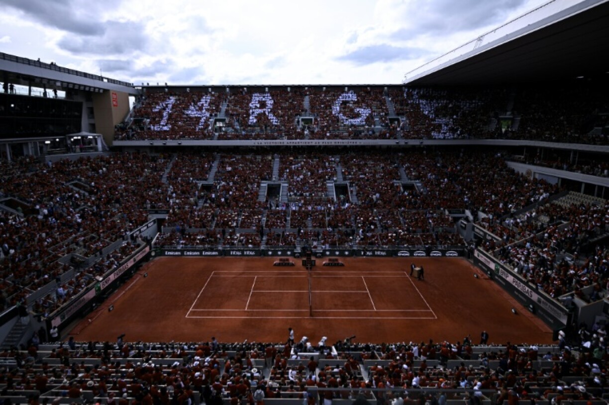 Organisers handed out free T-shirts to fans for Rafael Nadal's ceremony at Roland Garros
