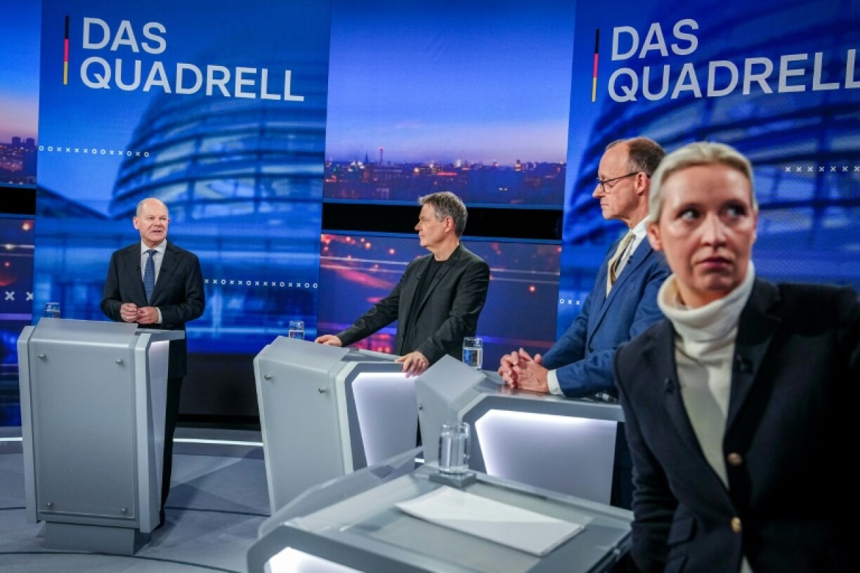 Alice Weidel, head of the far-right AfD, at a TV debate, with three other top candidates in the background