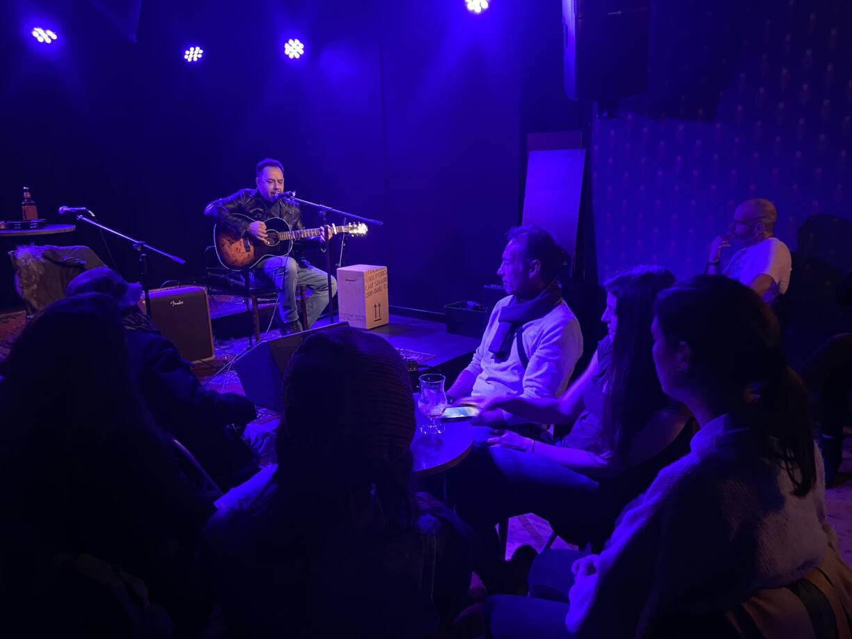 An intimate open mic night at Rocas