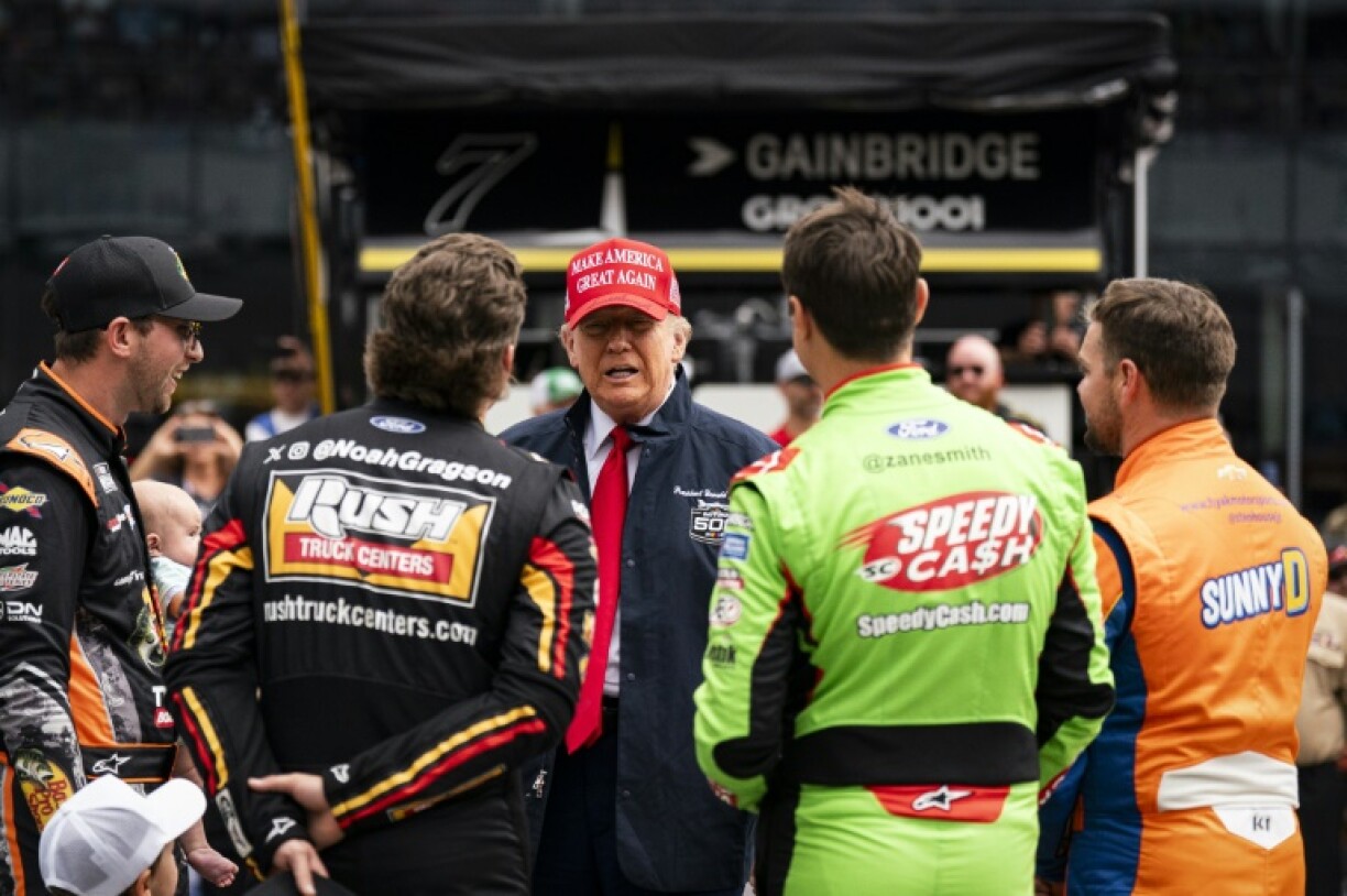 US President Donald Trump greets drivers during a visit to NASCAR's Daytona 500 in Florida