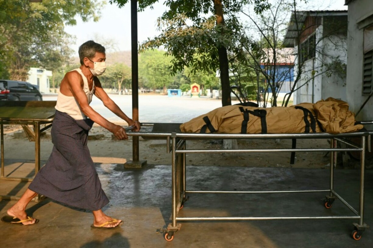 A worker transports the body of an earthquake victim for cremation at a facility on the outskirts of Mandalay, Myanmar on March 31, 2025