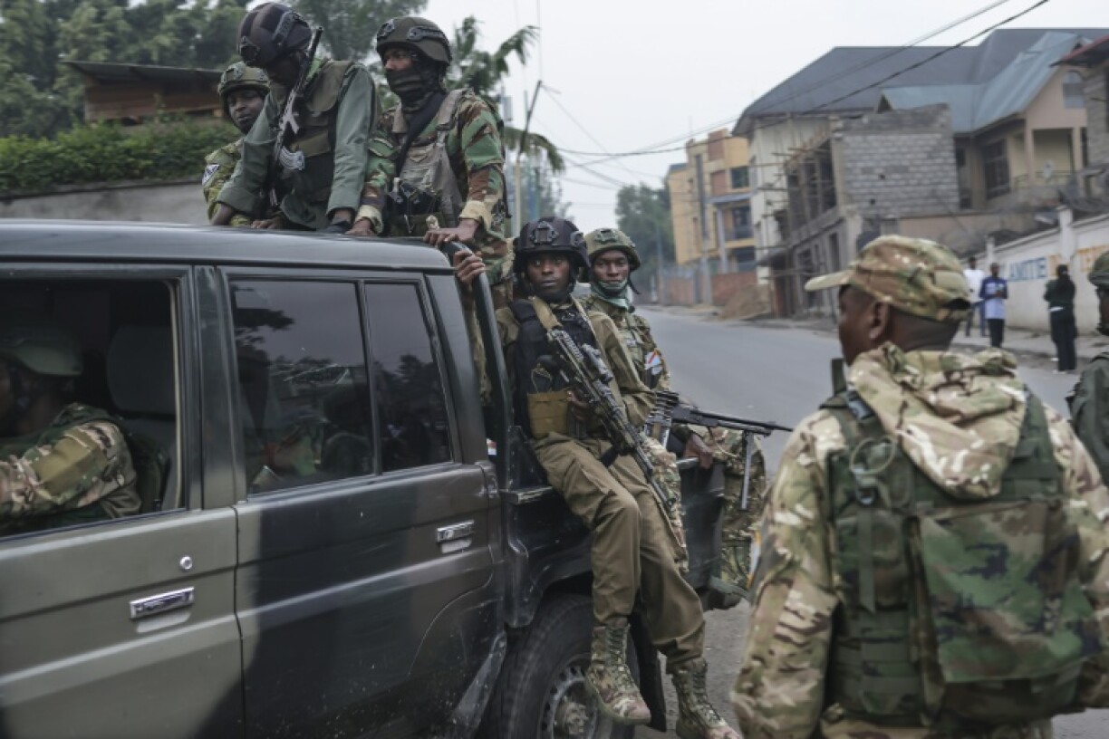 M23 fighters board a pickup truck to go on patrol