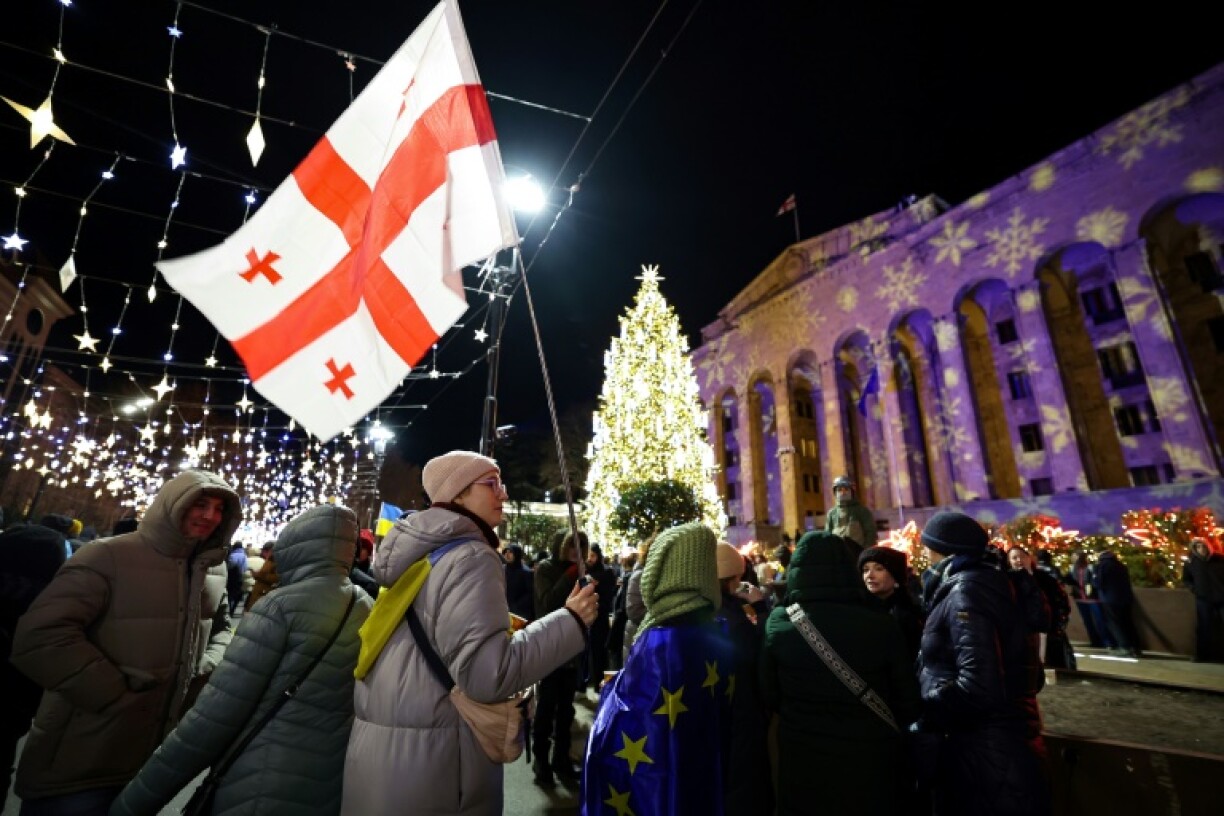 Protesters staged marches at a dozen locations across the capital Tbilisi before several thousand gathered outside parliament for 20th consecutive day