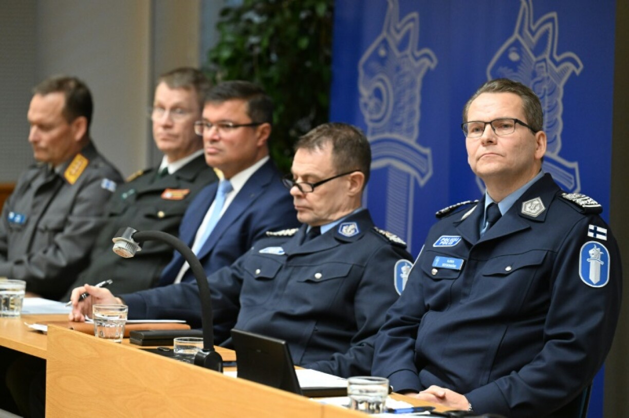 Robin Lardot of Finland's National Bureau of Investigation (R) said a probe for 'aggravated sabotage' had been opened