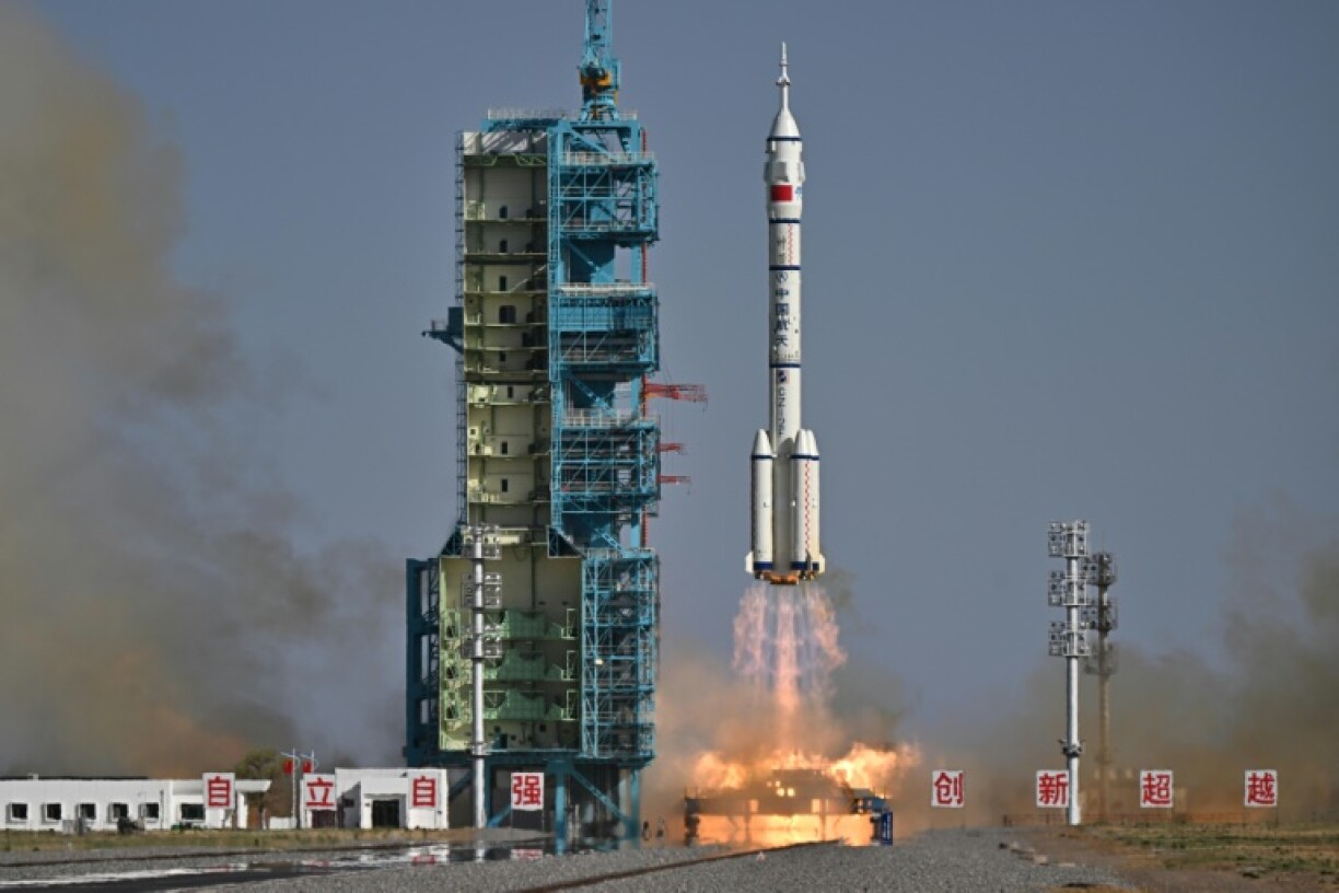 Three Chinese astronauts blasted off from a remote desert launch site at the start of a six-month mission to China's space station