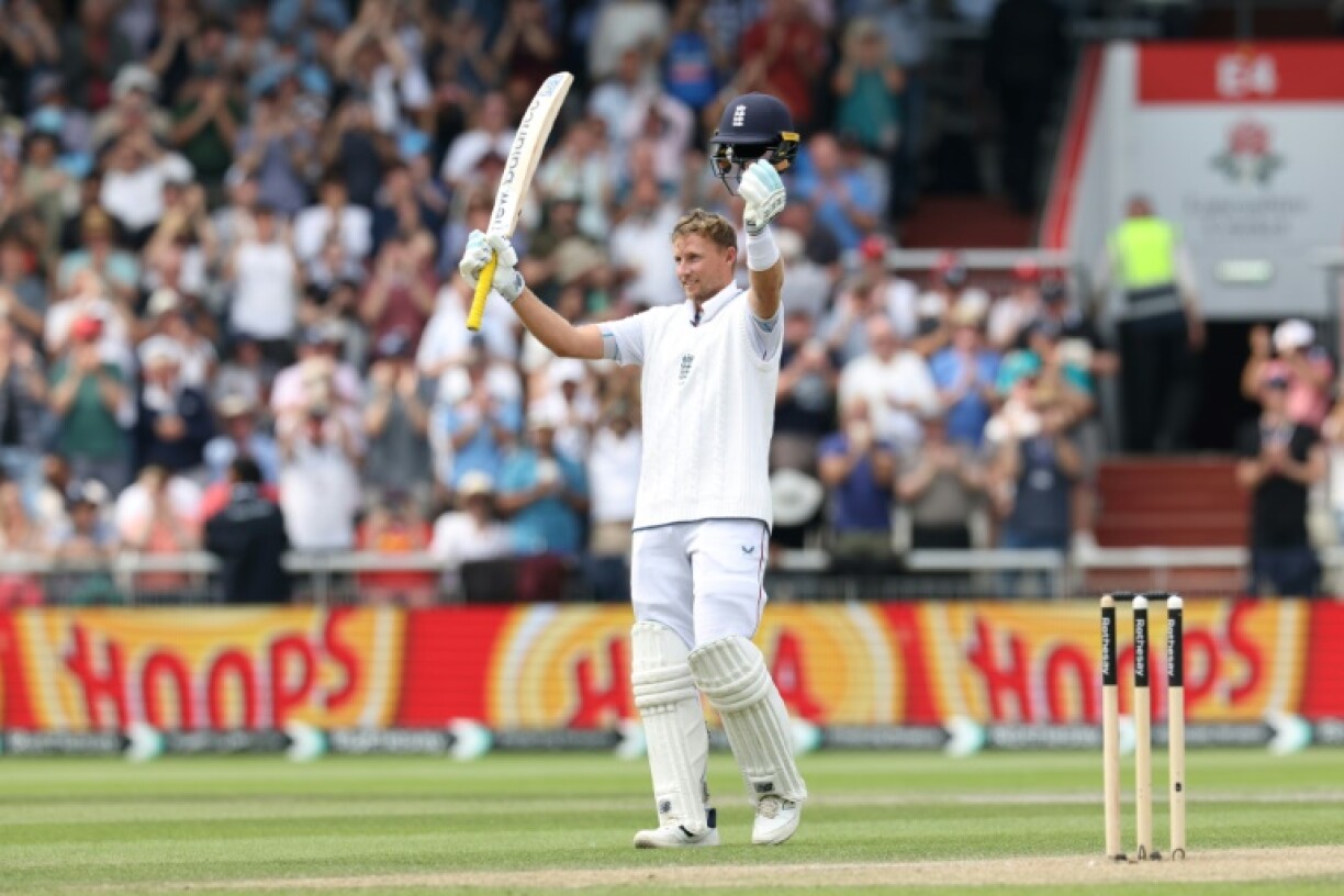 England's Joe Root celebrates his century in the fourth Test against India at Old Trafford