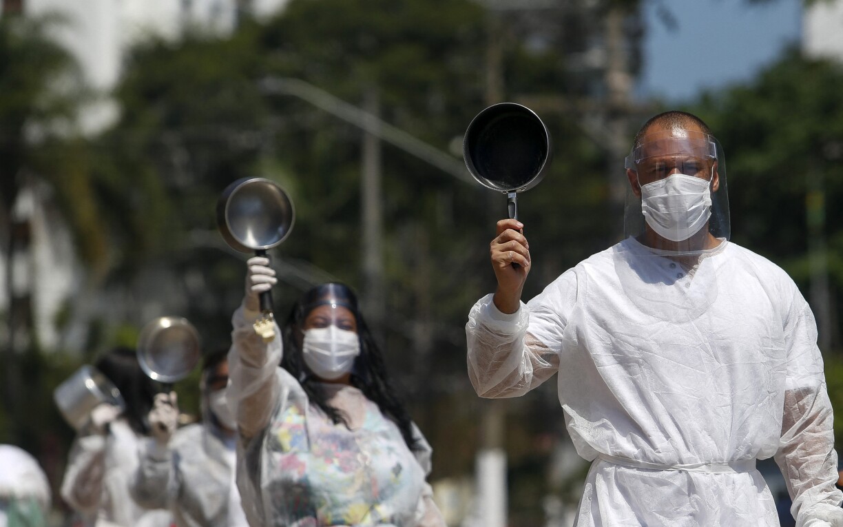 Demonstrators perform as part of the