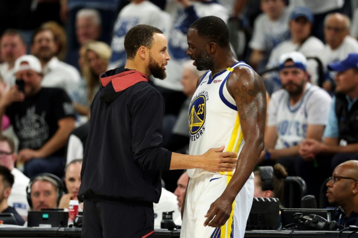 Draymond Green (right) speaks with teammate Stephen Curry after reacting furiously over a technical foul in Golden State's playoff defeat to Minnesota