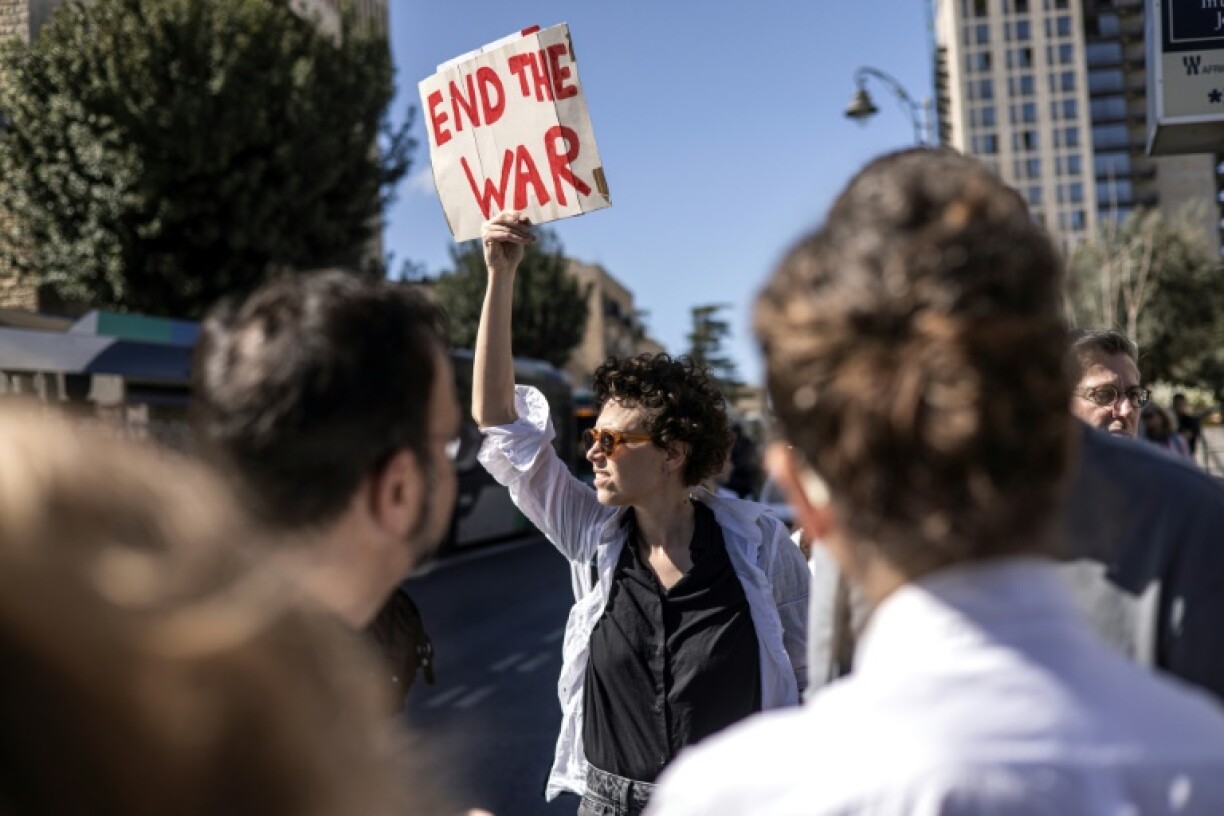 Among the banners held by protesters were many calling on the government to end the war