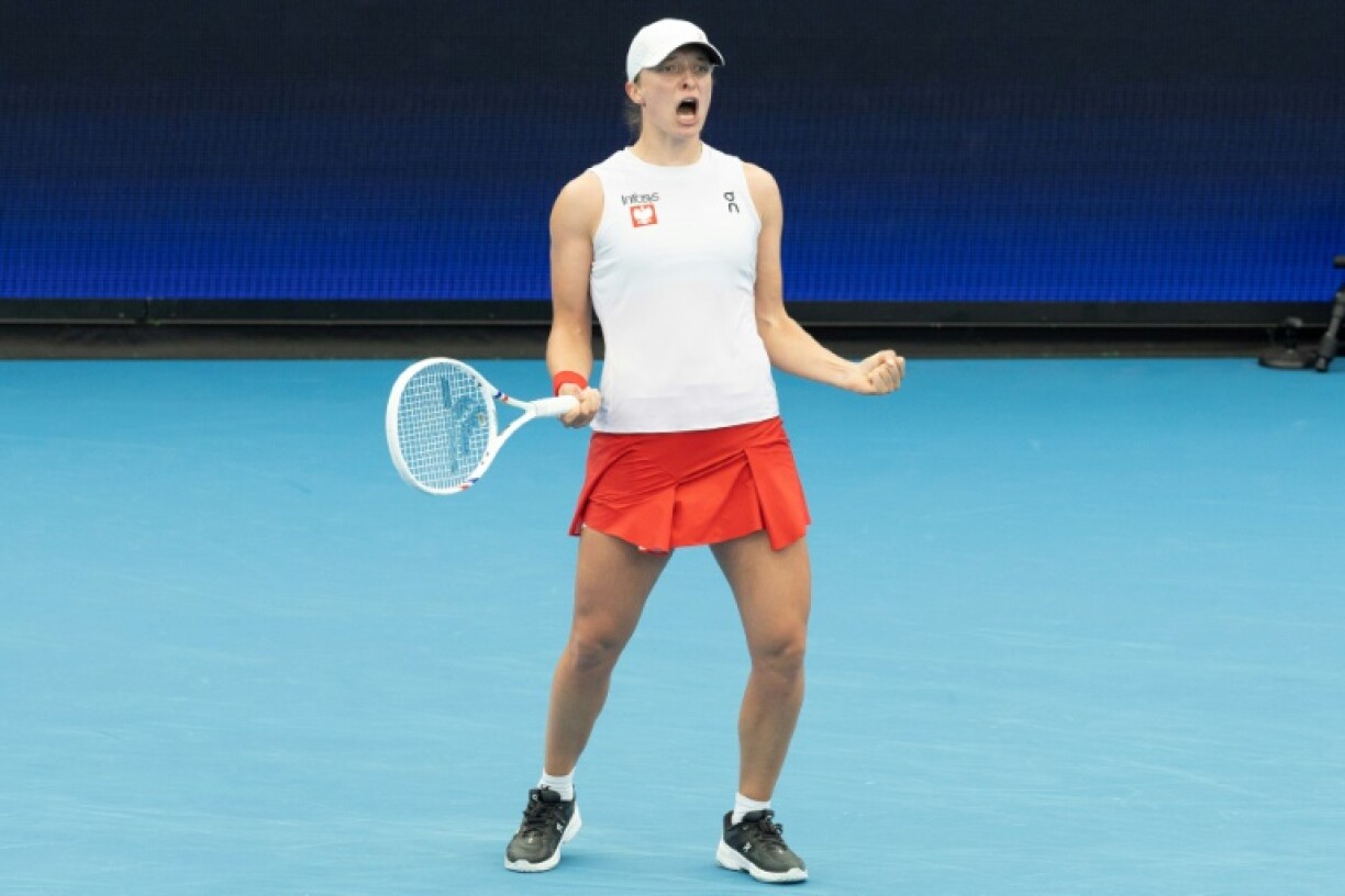 Iga Swiatek reacts after winning the first set against Kazakhstan's Elena Rybakina