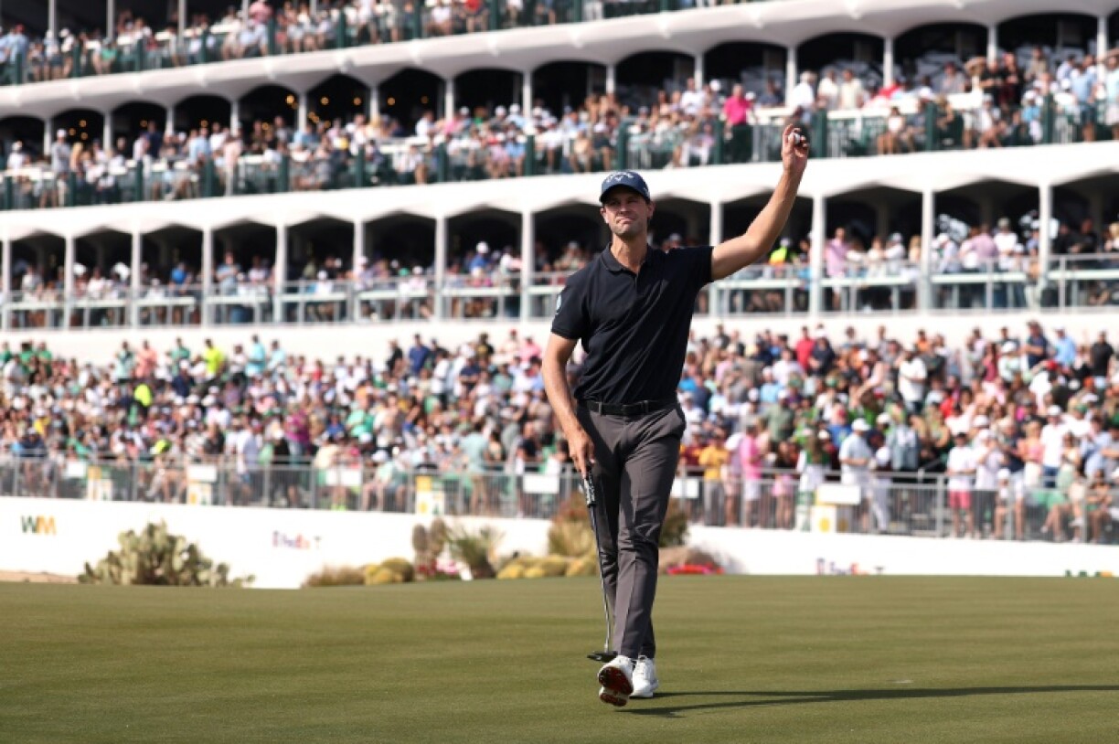 Belgian Thomas Detry acknowledges the crowd on the 16th green on the way to the second-round lead at the US PGA Tour Phoenix Open