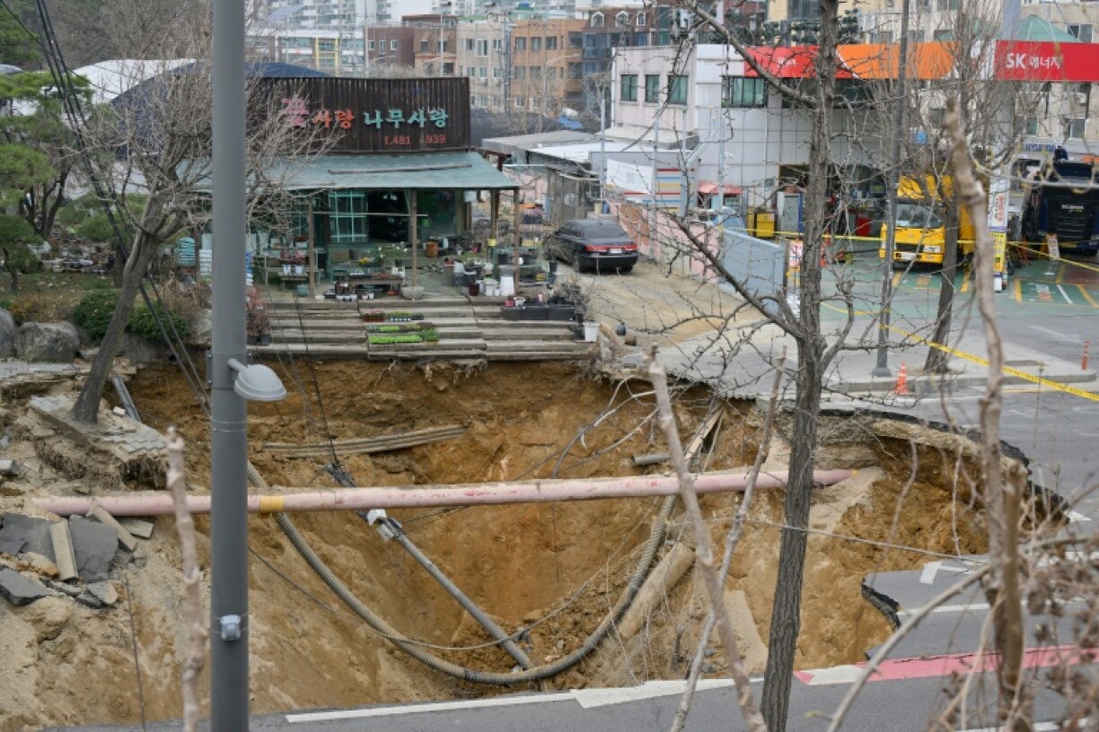 One person has been killed after a massive sinkhole opened up in Seoul, the fire department said, with harrowing video footage showing the moment his vehicle was swallowed by the hole