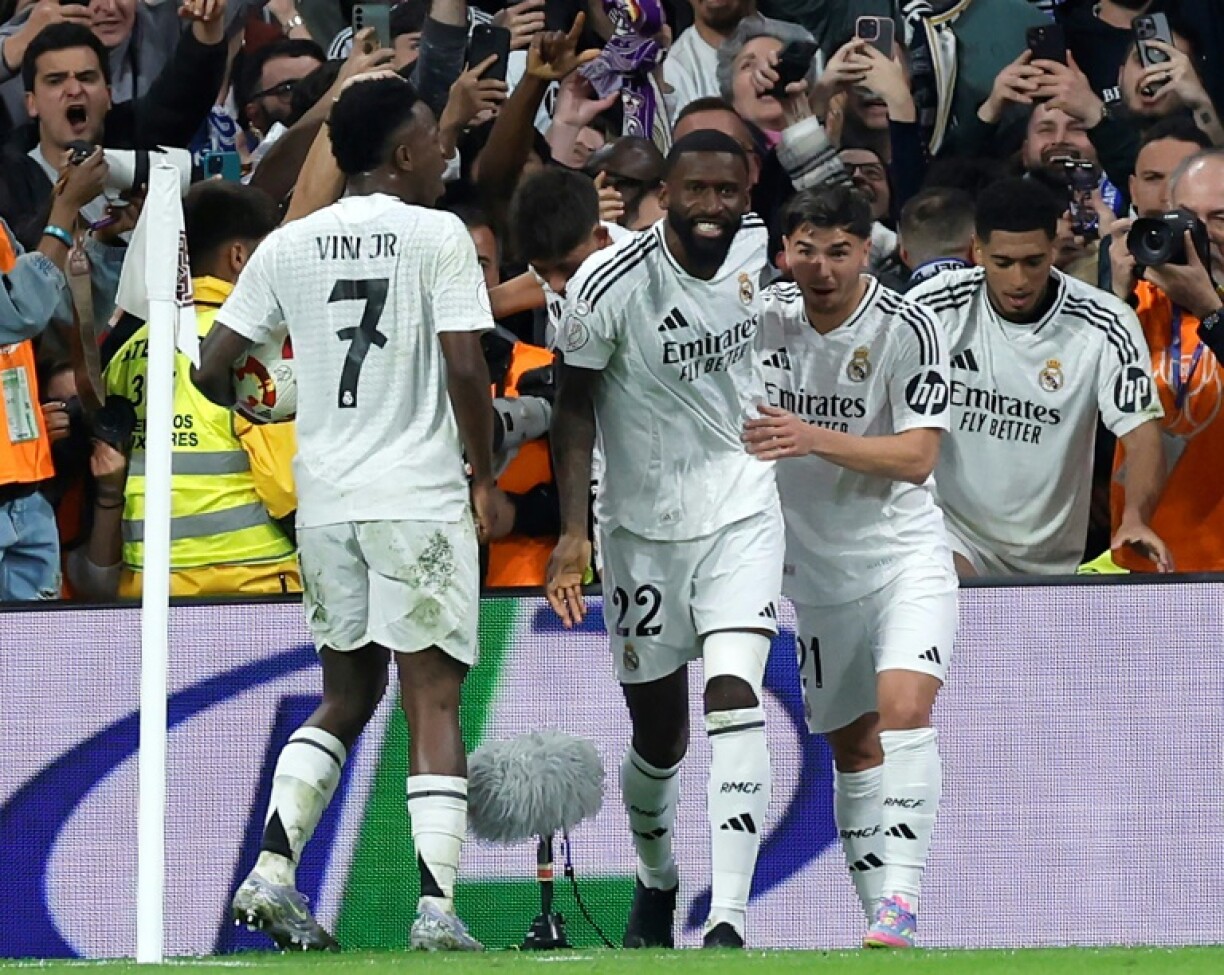 Real Madrid's German defender Antonio Rudiger (C) celebrates scoring his team's fourth goal against Real Sociedad