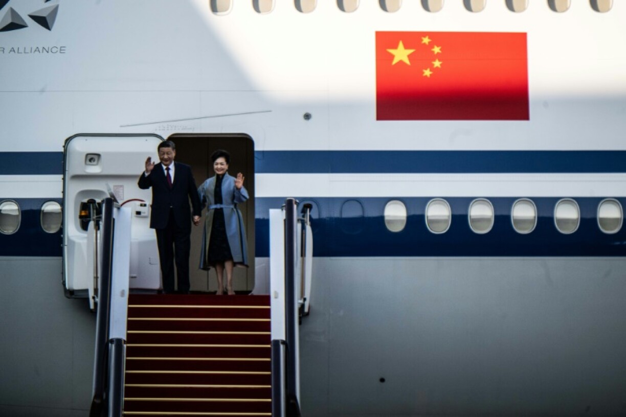 President Xi Jinping and his wife Peng Liyuan arrive in Macau ahead of celebrations for the 25th anniversary of the city's handover from Portugal to China