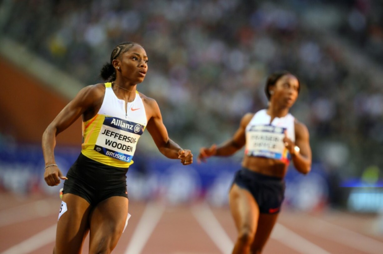 US sprinter Melissa Jefferson-Wooden (L) wins the 100m at the Brussels Diamond League