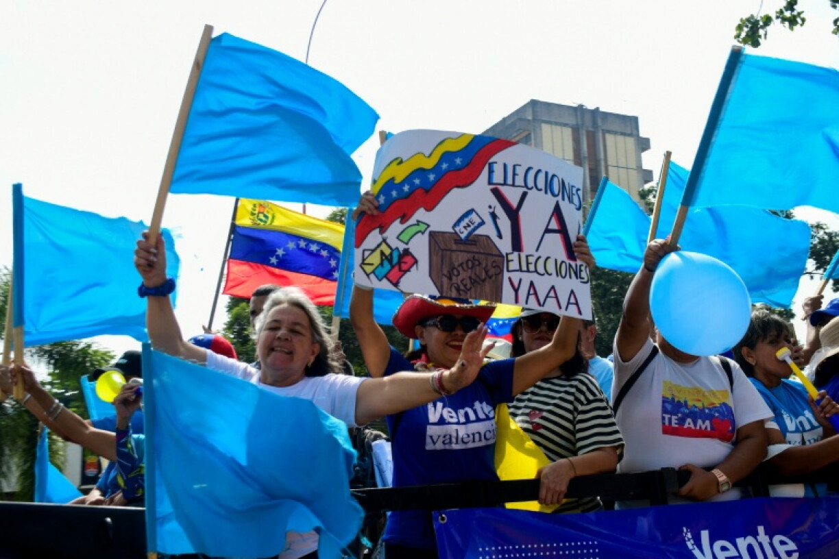 Demonstrators attend a rally to demand the return of opposition leader Maria Corina Machado to the country on a street in Valencia, Carabobo Sate on Sepetember 27, 2026.