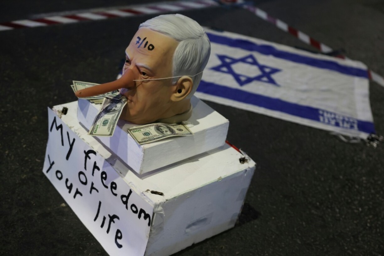 A mask of mocking Israeli Prime Minister Benjamin Netanyahu during a demonstration in Tel Aviv