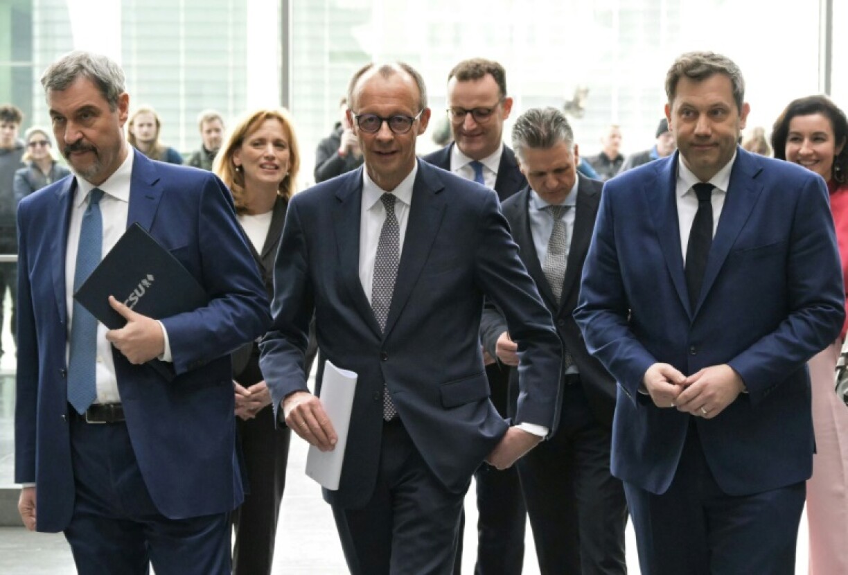 Friedrich Merz, centre, hopes to launch his new government in early May