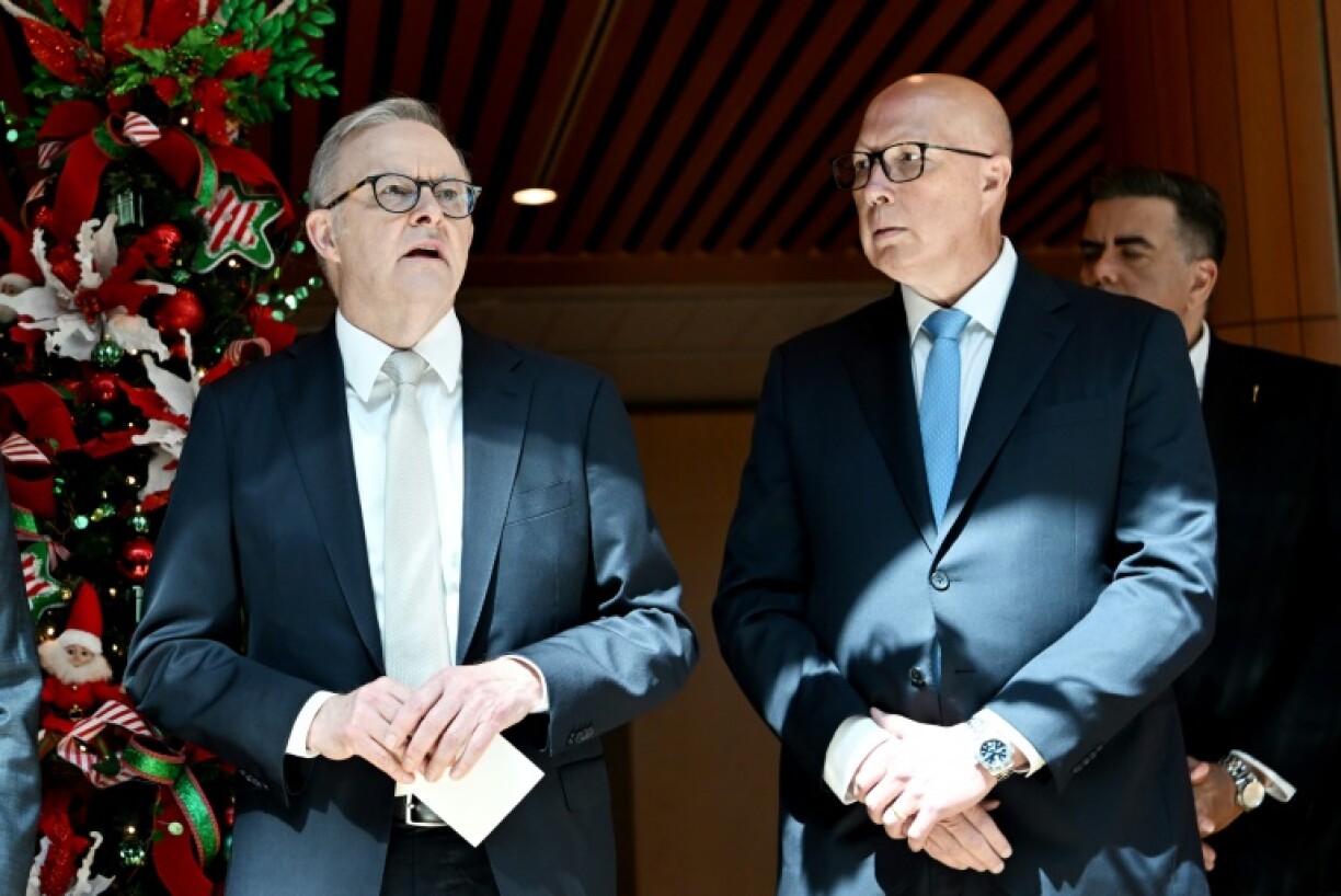 The election pits left-leaning incumbent Prime Minister Anthony Albanese (L) against staunchly conservative rival Peter Dutton