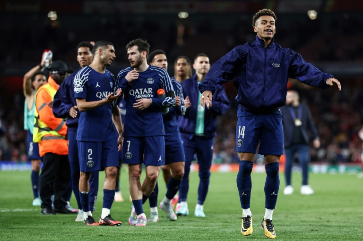 Paris Saint-Germain players celebrate at the end of their victory over Arsenal in the first leg of their Champions League semi-final on Tuesday