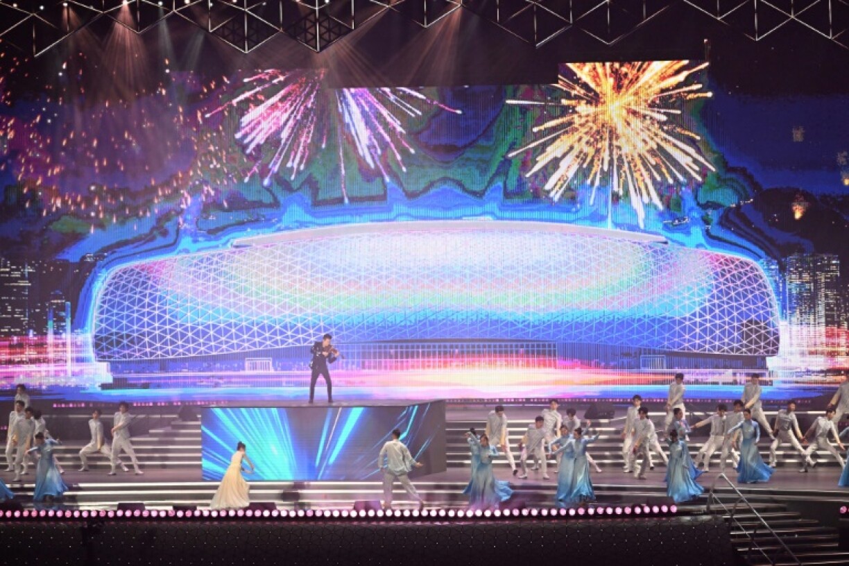 Dancers perform at the opening of the Kai Tak Sports stadium