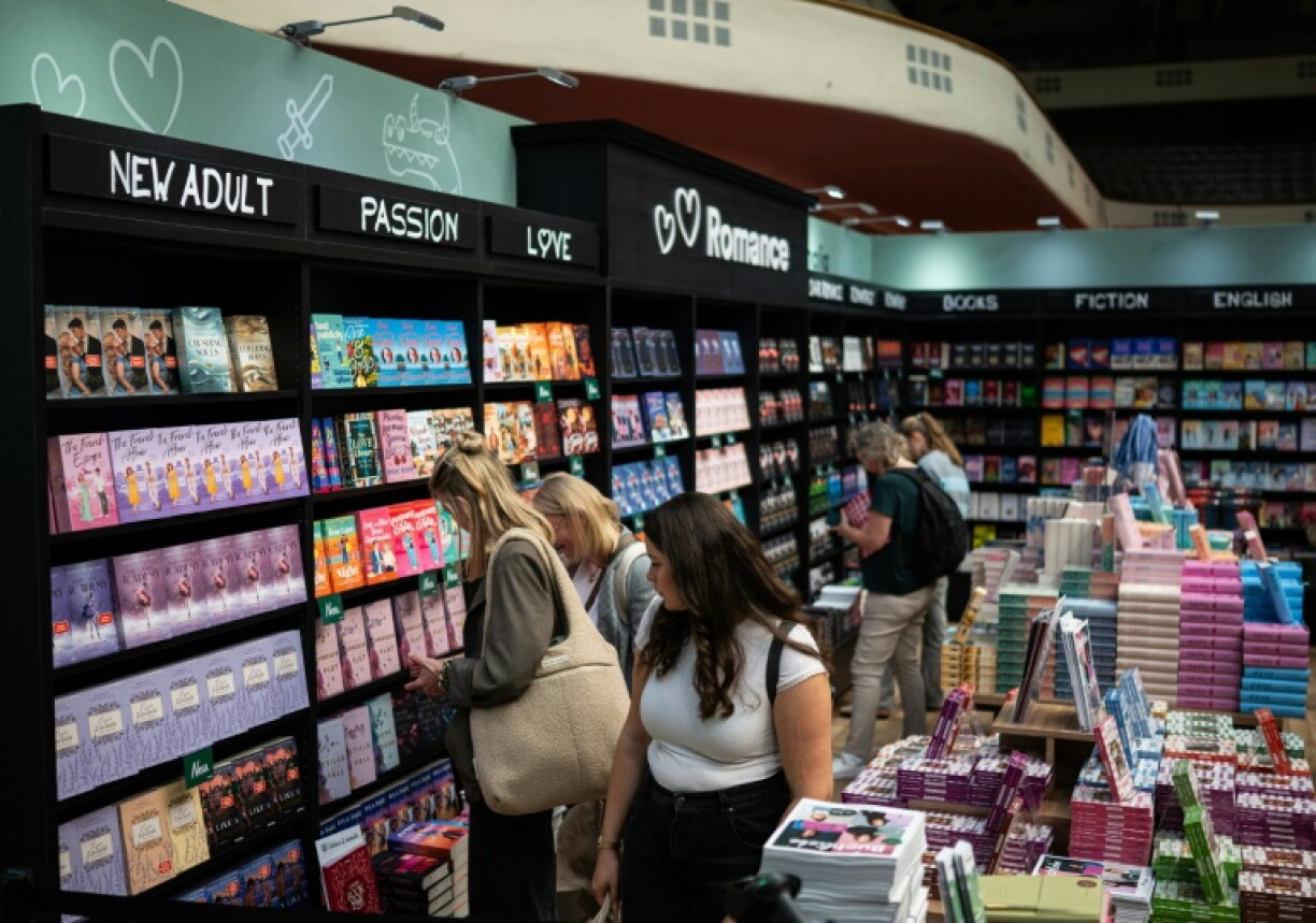 Visitors browse bookshelves at the Frankfurt Book Fair