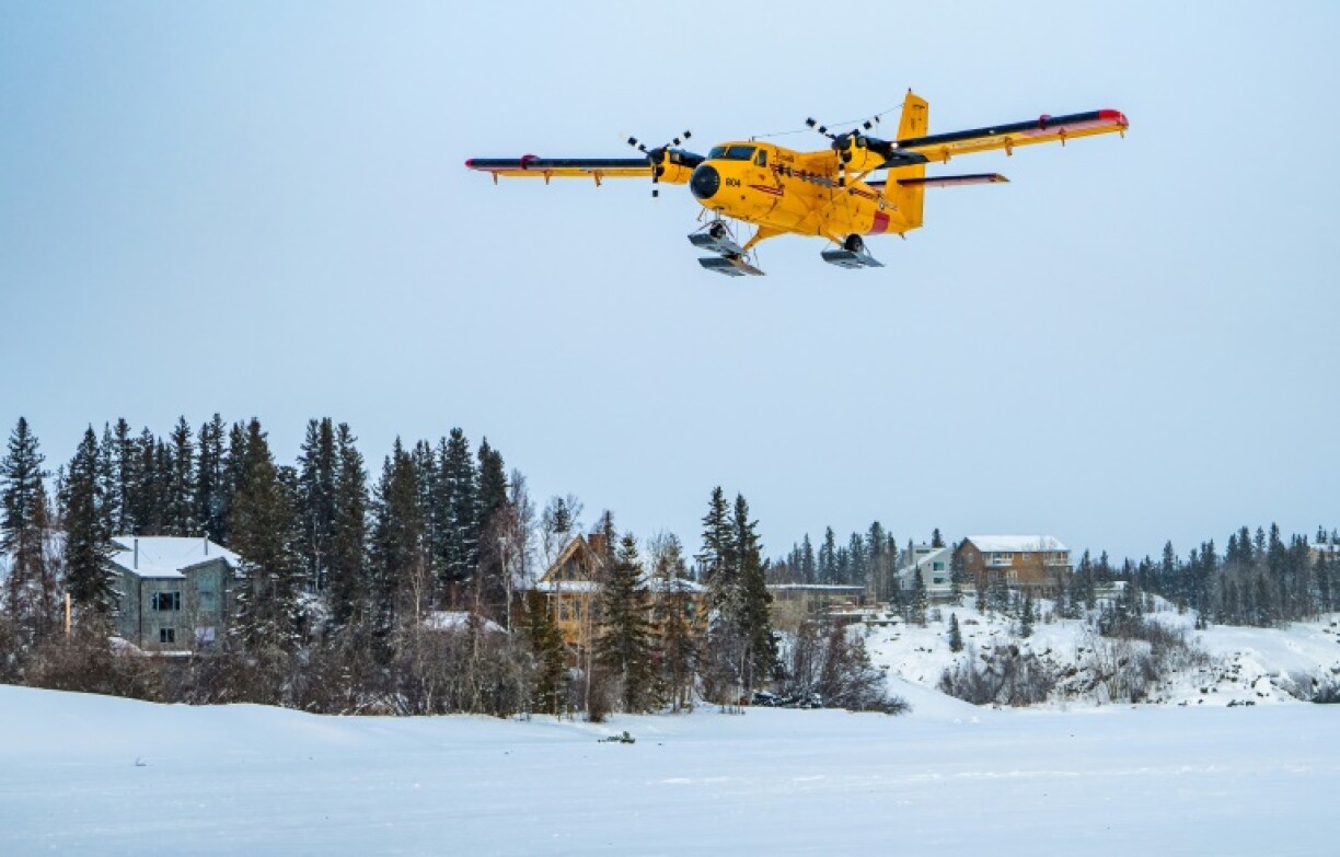 A Royal Canadian Air Force CC-138 Twin Otter approaches for a landing on a frozen lake in Yellowknife, Canada