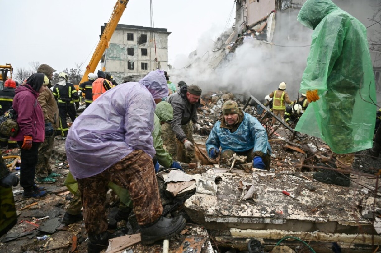 Rescuers were combing the ruins of a smouldering building in Poltava, central Ukraine, for survivors