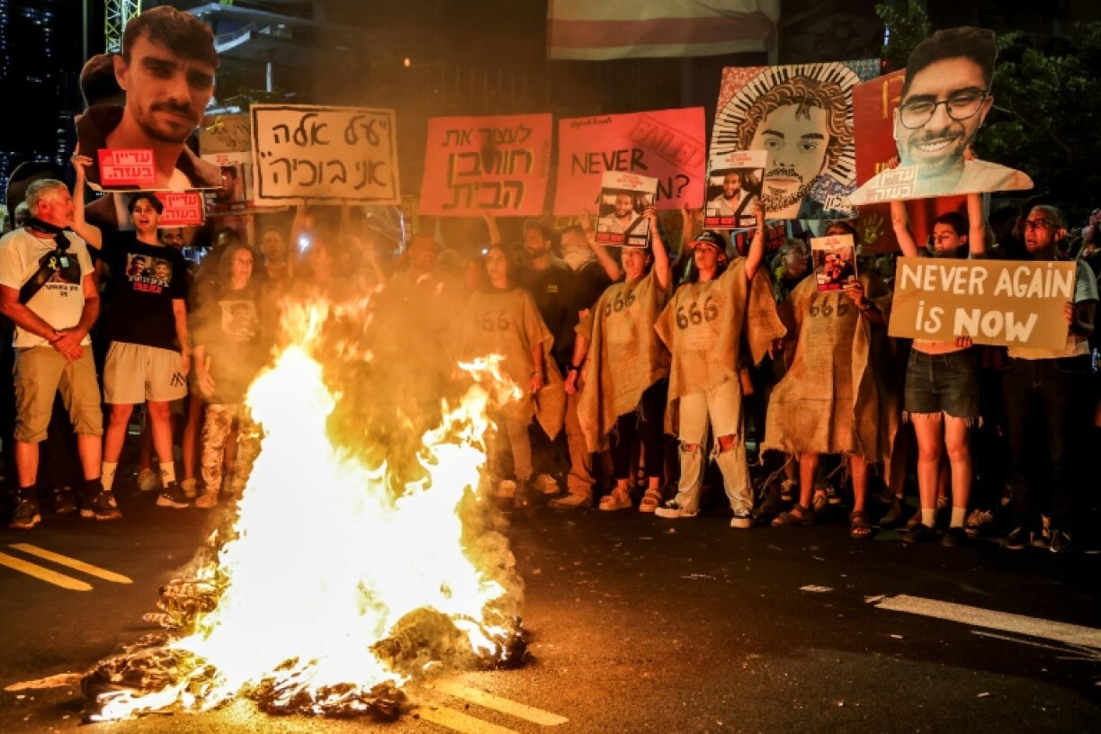 Demonstrators in Tel Aviv call for action to secure the release of hostages held in Gaza, after Palestinian groups released videos of two captives