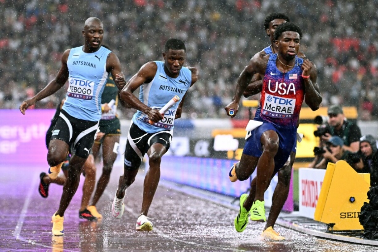 (From L) Botswana's Letsile Tebogo, Botswana's Bayapo Ndori, US' Jacory Patterson and US' Khaleb McRae compete in the men's 4x400m relay final