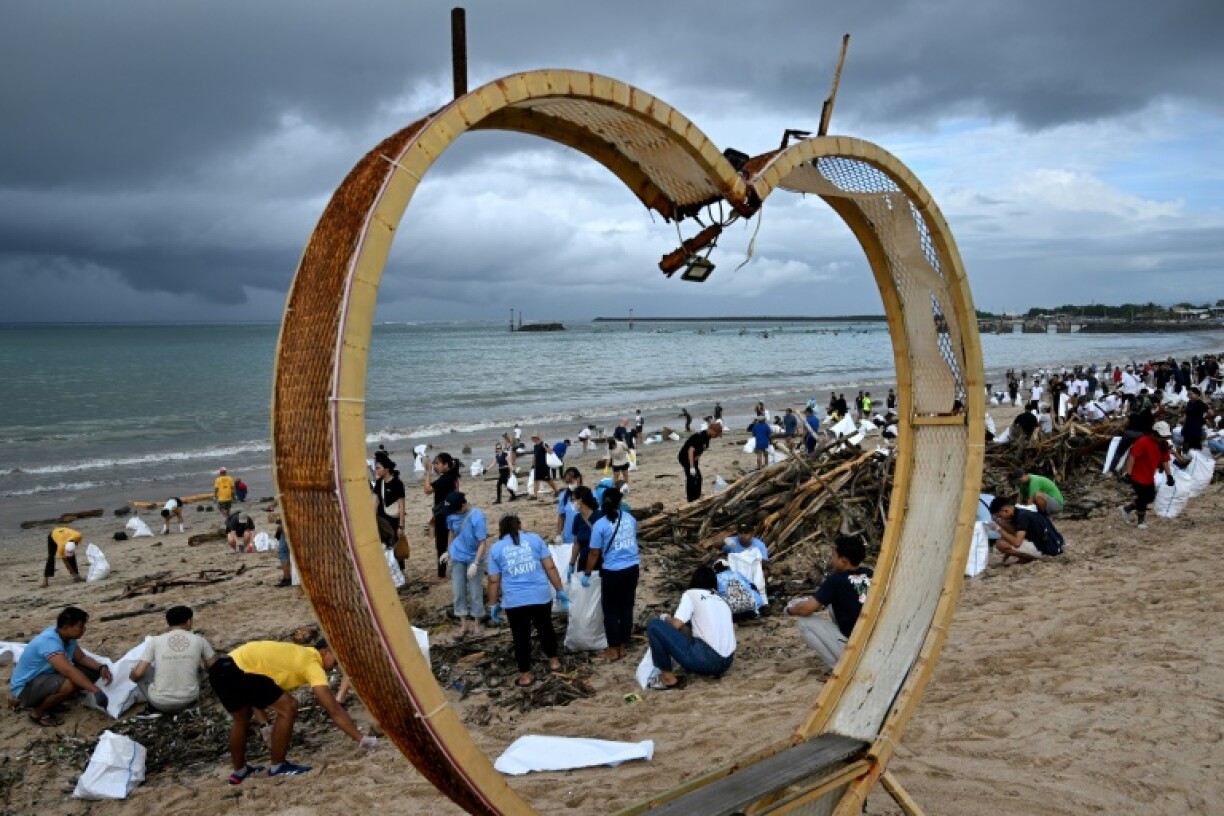 Plastic waste and other garbage is cleared from a beach in Kedonganan Badung regency on Indonesia's Bali island