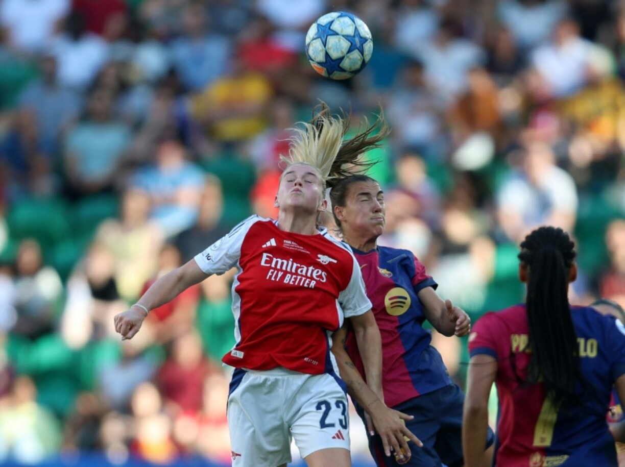 Arsenal striker Alessia Russo and Barcelona midfielder Patricia Guijarro jump for the ball during the UEFA Women's Champions League final in Lisbon
