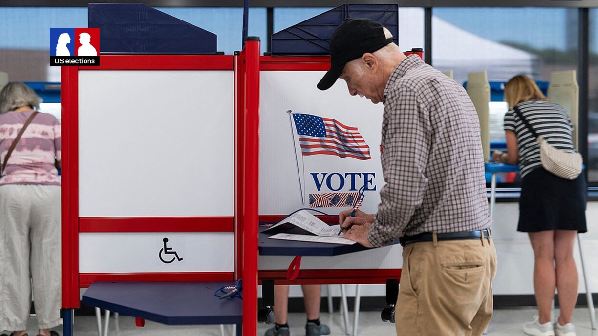 Voters fill out their ballots at the Minneapolis Elections & Voter Services building on 20 September, the first day of early voting in Minnesota ahead of the 2024 presidential election in November.