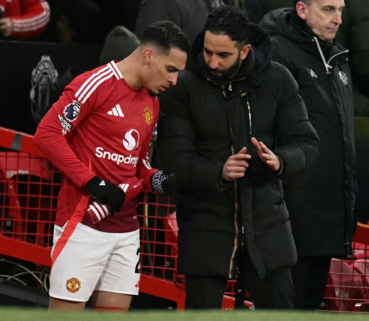 Manchester United's coach Ruben Amorim (R) pictured talking to Antony, who has joined Real Betis on loan