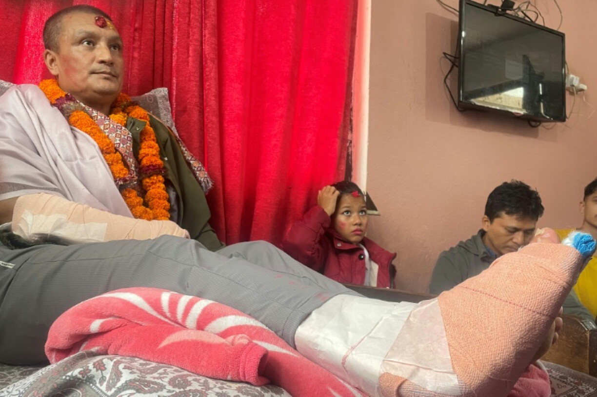 Nepali flood survivor Kabir Maharjan, who was rescued from a hydropower project tunnel, takes part in an interview with AFP at his home in Kirtipur on September 25, 2026, after being discharged from hospital.