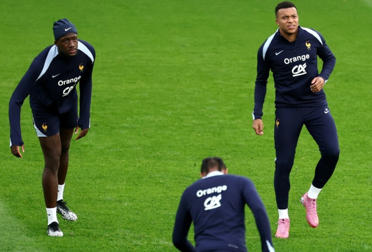 France forward Kylian Mbappe (R) and defender Ibrahima Konate (L) will miss Monday's World Cup qualifier in Iceland with injuries