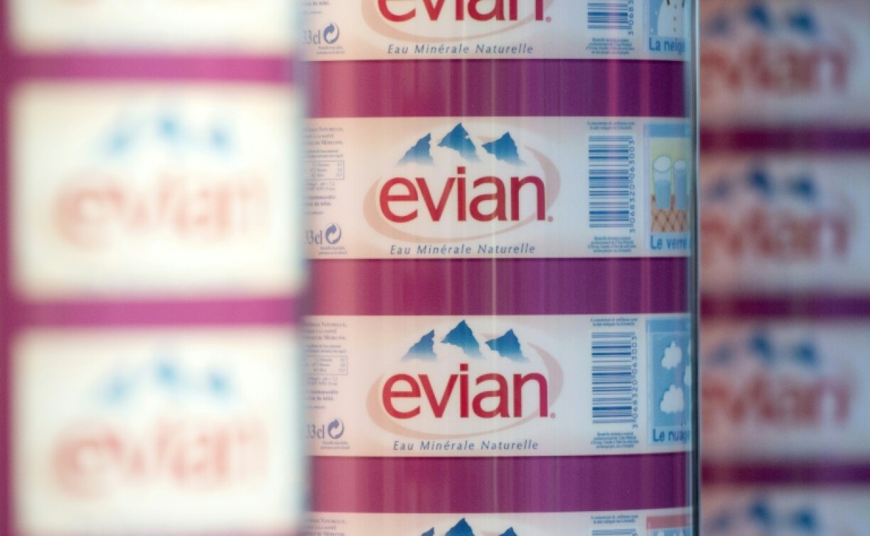 The logo of Evian mineral water is pictured on labels on the production line of its factory in Evian-les-Bains, eastern France in 2012