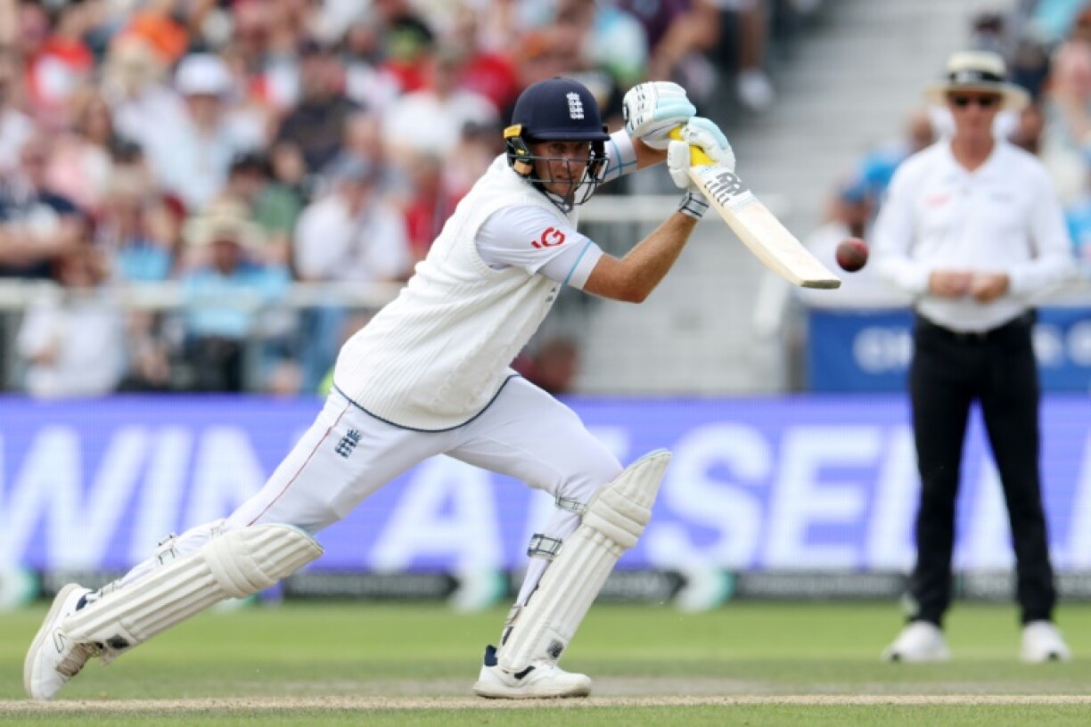 England's Joe Root drives during his innings of 150 in the fourth Test against India at Old Trafford