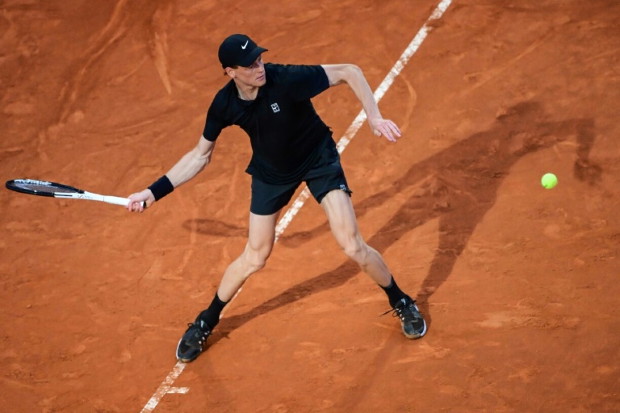 Jannik Sinner hits a forehand during his winning return to tennis action at the Italian Open