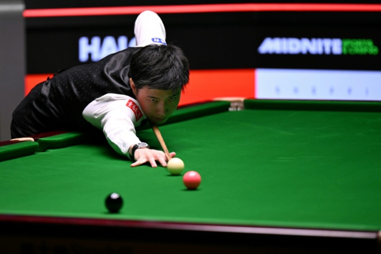 China's Zhao Xintong in action against Mark Williams in the World Snooker Championship final