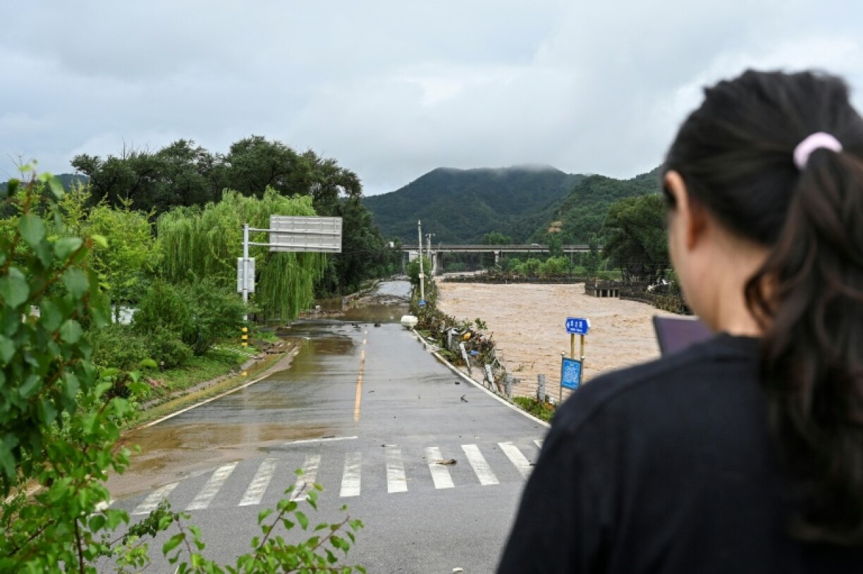 A damaged street after heavy rain in Miyun, on the outskirts of Beijing